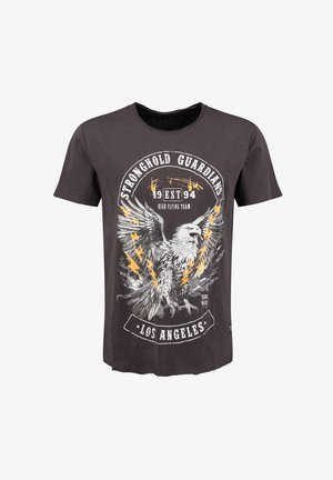 Camiseta negra de algodón con un diseño gráfico de un águila con rayos, texto circular y un dobladillo curvado.