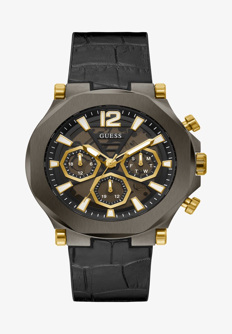 Must mustrakk kell musta nahk rihmaga, mitme kihilise halli korpusega, kuldsete aktsentidega ja musta taustaga, millel on kuue nurgaga alad ja julged tunni markerid.