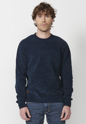 - Sweter