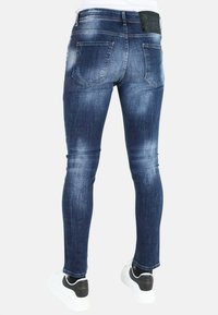 Local Fanatic PAINT SPLATTER GATEN - Slim fit jeans - blauw
