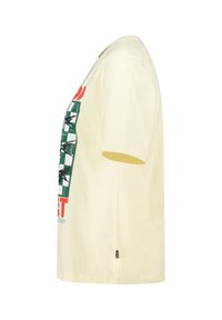 Yellow cotton t-shirt with short sleeves, featuring a green and red graphic print on the front. Simple, loose-fitting design.