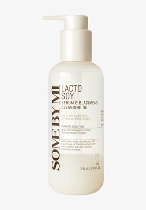 Flaske med Some By Mi Lacto Soy Sebum og Blackhead Cleansing Oil med pumpe, 200 ml, mærket som ikke-komedogen og dermatologisk testet.