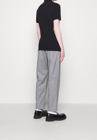 MOSCHINO Piké - black