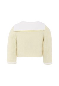 Giacca cropped in tweed gialla con colletto piatto bianco e polsini bianchi. Il tessuto texture crea un motivo sottile. Maniche a tre quarti.