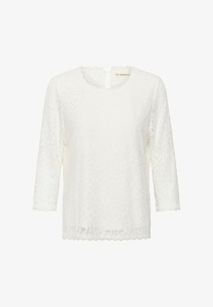 Balta nėriniuota palaidinė su trimis ketvirtadaliais rankovėmis, banguota apatine krašto linija ir apvaliu kaklu. Dėl atvirojo rakto skylutės detalės nugaroje.