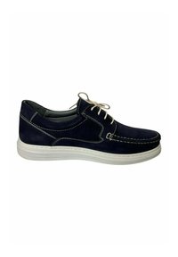 Zapato de ante azul marino con costuras blancas, diseño con cordones y suela de goma blanca. Presenta una textura suave y punta redondeada.