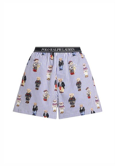 Kort bomullskjol med vertikala blå och vita ränder. Dekorerad med tecknade björnmotiv i olika kläder. Elastiskt svart midjeband.