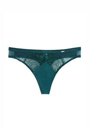Teal lingerie tanga lavet af et blødt, glat stof med blonde accenter; har et prikket mønster og en detaljeret blomsterblonde foran.