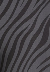 Black and gray fabric featuring a wavy zebra stripe pattern. The texture is smooth with a slight sheen, highlighting the contrasting colors.