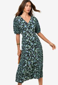 Florales Midikleid mit Puffärmeln, navyfarbener Hintergrund, grün-blaues Blumenmuster, V-Ausschnitt-Design, sanft bis zur Mitte der Wade fallend.