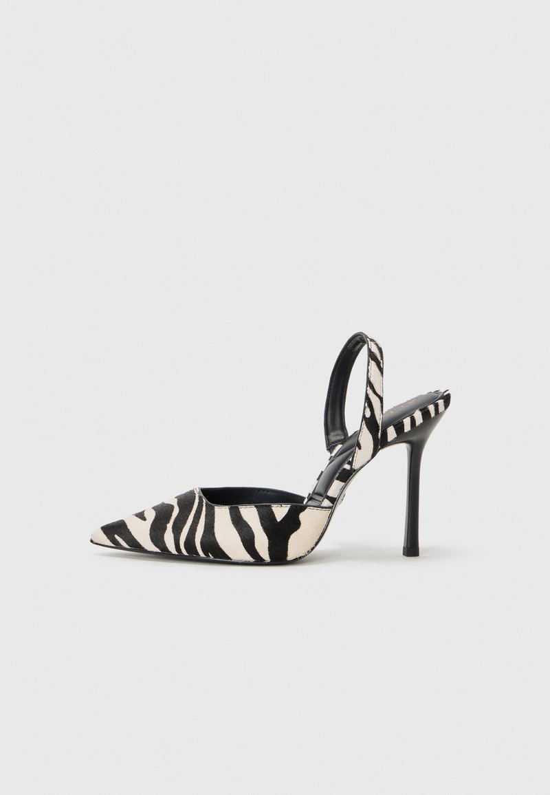 Pointed-toe slingback heel in black and cream zebra print, featuring a slim high heel and open back design with a black interior.