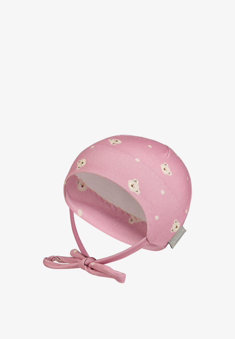 Weicher rosa Babykäppi mit Teddy-Bär und Punkten-Muster, mit gebundenen Trageriemen und einem kleinen Stoffmarkenetikett an der Seite.