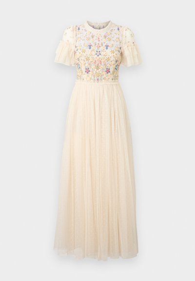 Robe midi couleur crème avec des manches courtes à volants, broderie florale sur le corsage, et une jupe fluide et transparente à pois.