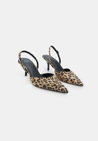 Pair of pointed-toe slingback heels with leopard print and black leather insoles on white background.