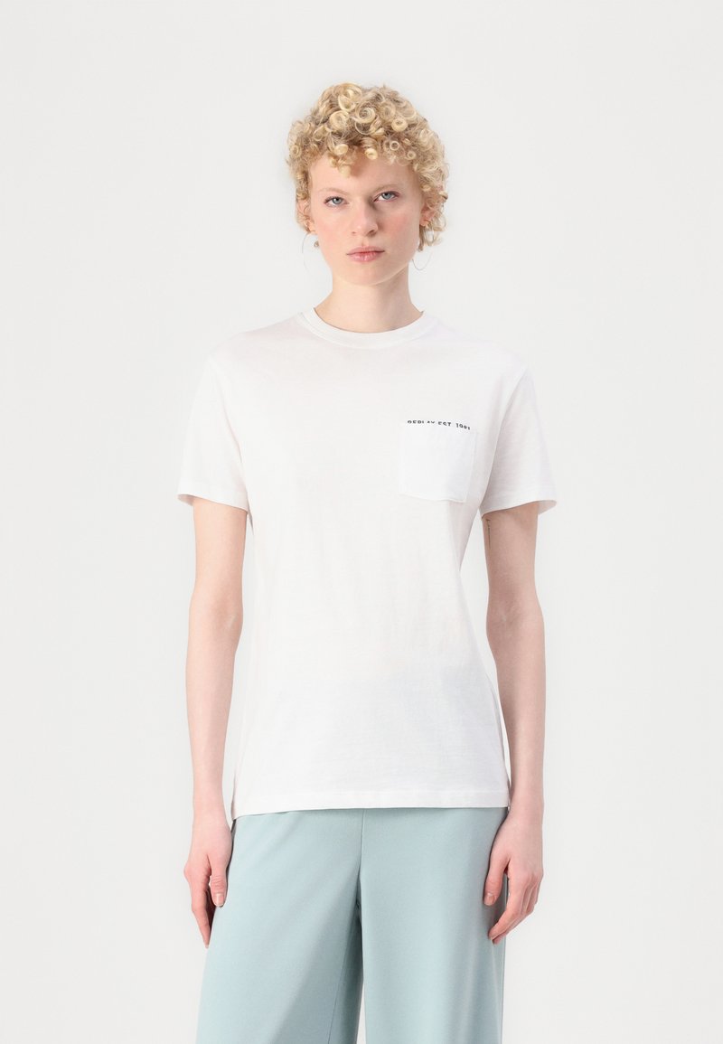 White cotton t-shirt with a round neckline, short sleeves, and a chest pocket featuring black text. Smooth texture, simple design.