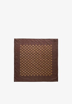 Ruskea neliön muotoinen kangas, jossa on keskellä ruudukkoon järjestetty symmetrinen kuvio pienistä keltaisista kukkakuvioista.