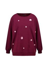 Langdurige maroon sweatshirt met roze 3D-florale applicaties verspreid over de voorkant en ribgebreide manchetten en onderkant.