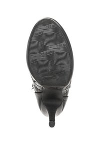 Zapato de tacón alto negro con suela de goma texturizada que presenta patrones en forma de ondas y una marca. El material superior parece suave con un diseño elegante.