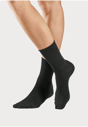 Black cotton socks with ribbed cuffs, ankle-length, smooth texture, fitted design, and no visible patterns or accents.
