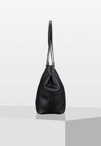Black leather hobo bag with a textured finish, featuring a drawstring closure and two long shoulder straps for carrying ease.
