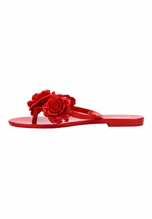 Red flip-flop sandals with glossy finish, featuring two textured floral accents on the straps. Flat sole with minimalist design.