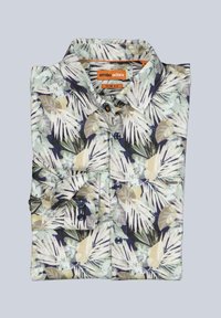 Men’s slim fit button-up shirt with beige, white, and green tropical leaf pattern, folded against a light gray background.