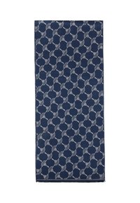 Marineblauw textiel met een herhalend geometrisch patroon van in elkaar grijpende cirkels met witte accenten, afgewerkt met rafelige randen.