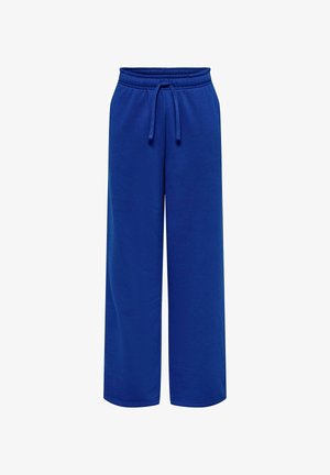 Niebieskie dresy wykonane z miękkiego materiału, z elastycznym pasem, regulowanym sznurkiem i szerokimi nogawkami. Gładka faktura na całej powierzchni.