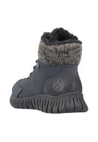 Bottines en cuir noir à la cheville avec un revers en tricot gris, semelle texturée et logo rond. Elles disposent d'un système de laçage et d'un intérieur rembourré pour un confort optimal.