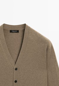 Khaki cardigan with a deep V-neck, textured knit fabric, and two black buttons at the front. Label reads "Massimo Dutti."