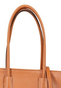 Tan leather tote bag with two sturdy handles, featuring a textured finish and structured shape. No visible hardware or patterns.