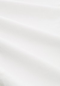 Cotton fabric in white, featuring a smooth texture and subtle sheen, draping softly with a slight stretch and diagonal weave pattern.