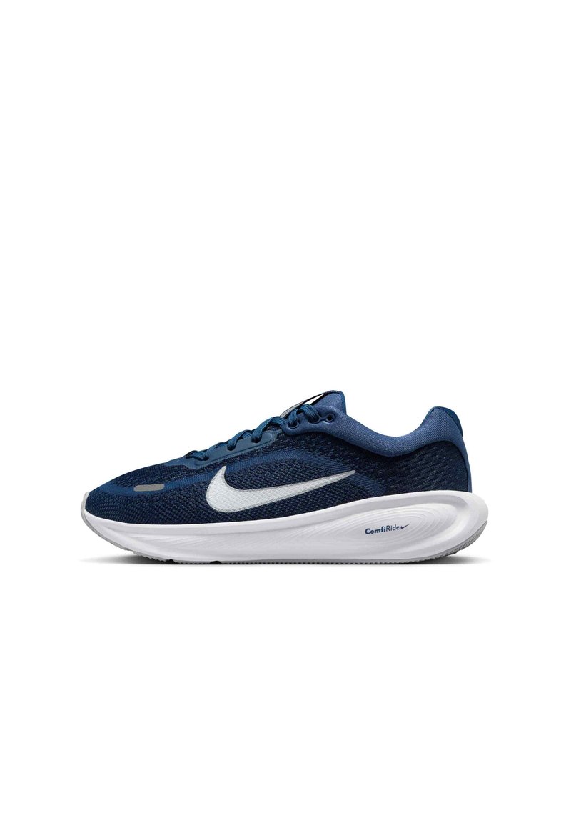 Kraljevo modri atletski copat z belim Nike swooshom in debelim belim podplatom, označenim kot "ComfiRide", prikazan v stranskem profilu na belem ozadju.