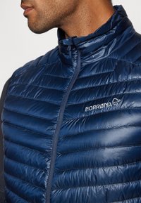 Norrøna TROLLVEGGEN SUPER LIGHT VEST - Strukirani kaput - indigo night