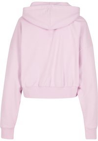 Hoodie scurt în roz deschis, cu o textură moale și netedă. Prezintă o glugă, mâneci lungi și tivuri și manșete ribbate.
