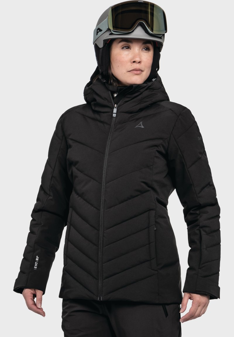 Schwarze isolierte Jacke mit Zickzackmuster, hohem Kragen, Reißverschluss und zwei Seitentaschen. Verfügt über eine strapazierfähige, glatte Textur.