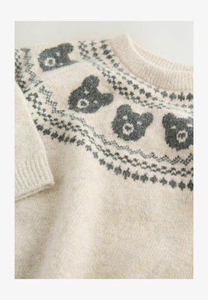 Sweter robiony na drutach w jasnym beżu z motywami ciemnoszarych niedźwiedzi na karczku, skomplikowanymi wzorami na brzegach, ściągaczami oraz miękkim, teksturowanym materiałem.