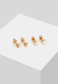 Gold-tone stud earrings featuring two pairs: one with a polished spherical design and the other with a lustrous faux pearl accent.