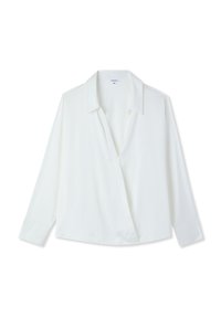 Blusa bianca a maniche lunghe con colletto, apertura a V e una vestibilità leggermente ampia, distesa su uno sfondo bianco.