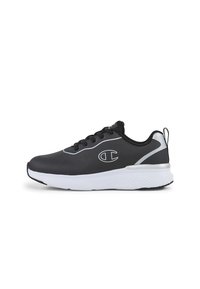 Zapatilla deportiva negra con parte superior sintética suave, mediasuela blanca, suela negra y detalles en gris. Presenta cordones redondos y un logo en el costado.