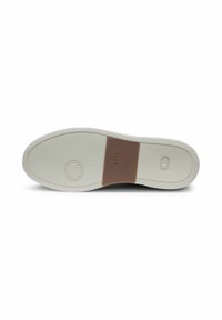 White sneaker sole with textured rubber grip, featuring a brown accent band and circular logo detail on the heel area.