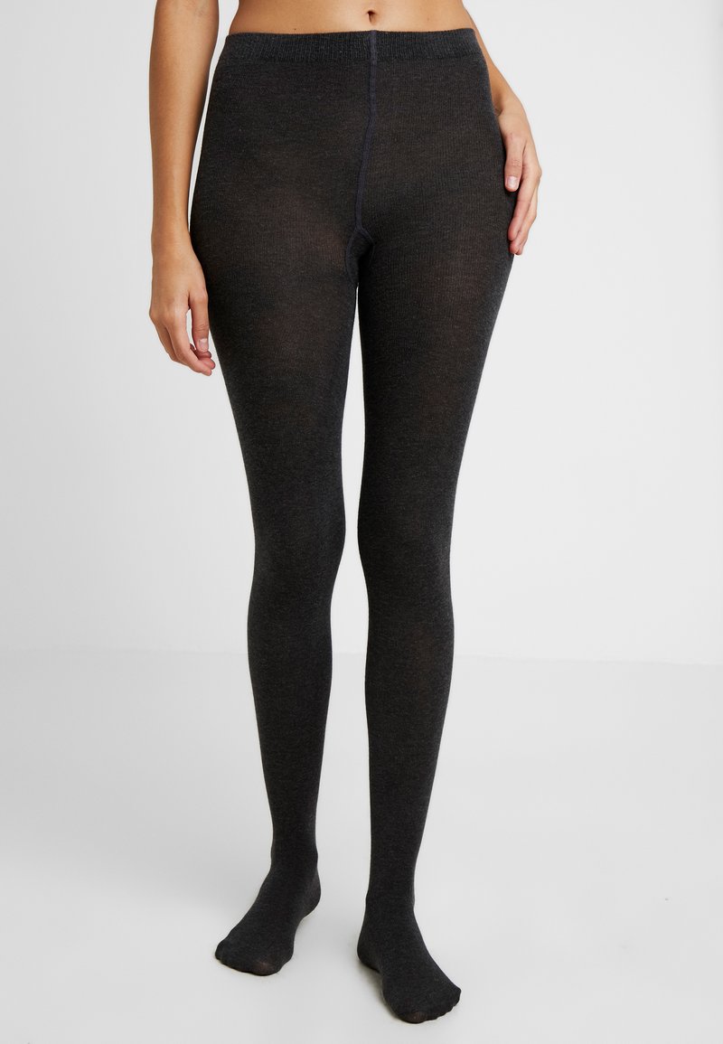 Czarne, dziane rajstopy wykonane z miękkiego, elastycznego materiału. Posiadają szeroką talię i dobrze dopasowaną sylwetkę, z gładką fakturą na całej powierzchni.