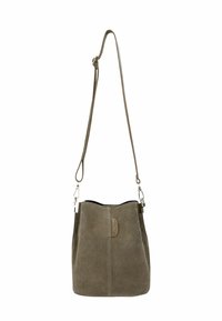 Brown suede bucket bag with adjustable shoulder strap and small stitched brand label on front center.