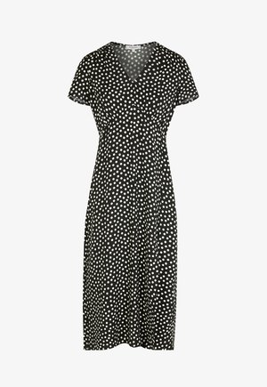 Musta midimekko, jossa valkoiset pilkkukuvioinnit, lyhyet hihat ja V-pääntie.