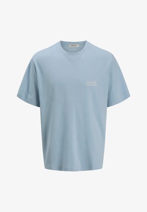 T-shirt in cotone azzurro chiaro con maniche corte, scollo rotondo e logo ricamato "Originals" sul lato sinistro del petto. Texture liscia.