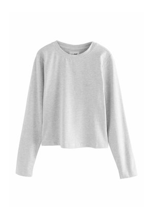 Pelēka garām piedurknēm cropped topiņš no mīksta auduma. Apaļa kakla izgriezums un minimālistisks logotips priekšpusē. Gluda tekstūra.