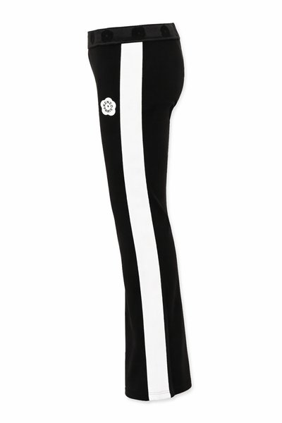 Pantalon noir avec une large rayure verticale blanche sur le côté et un petit logo fleur Kenzo Paris près de la taille.