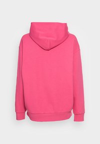 Felpa rosa con cappuccio, taglio largo e polsini a costine. Tessuto liscio, colore uniforme e banda in fondo. Visione posteriore senza alcun motivo.