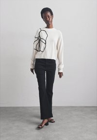 Stuart Weitzman NUDISTCURVE - Sandaalit nilkkaremmillä - black