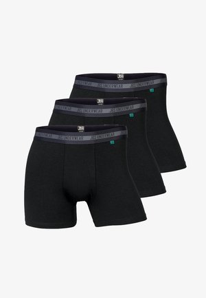 Czarne bawełniane bokserki z granatowym elastycznym pasem, na którym widnieje etykieta "JBS UNDERWEAR". Zestaw trzech sztuk, standardowy krój, gładka tekstura.